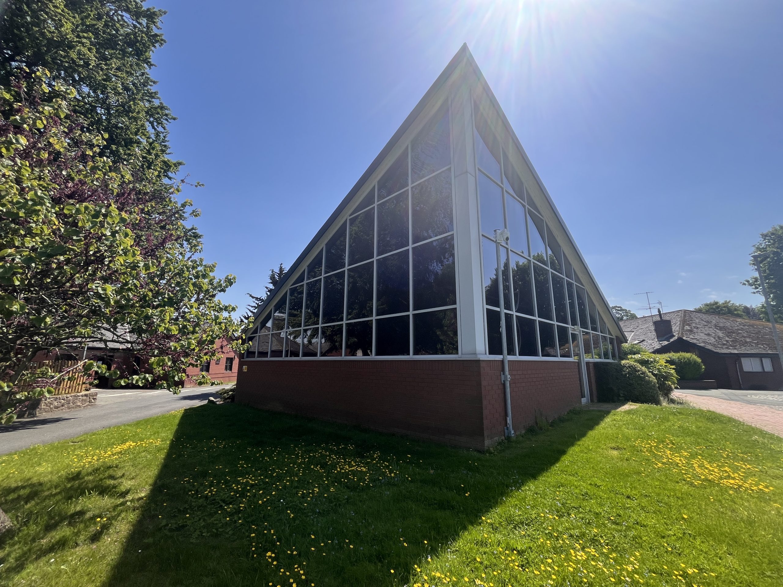 Modern building with a striking triangular glazed gable end